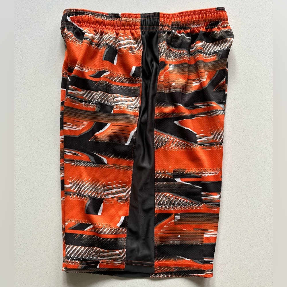 Under Armour Orange and gray patterned shorts in size YL